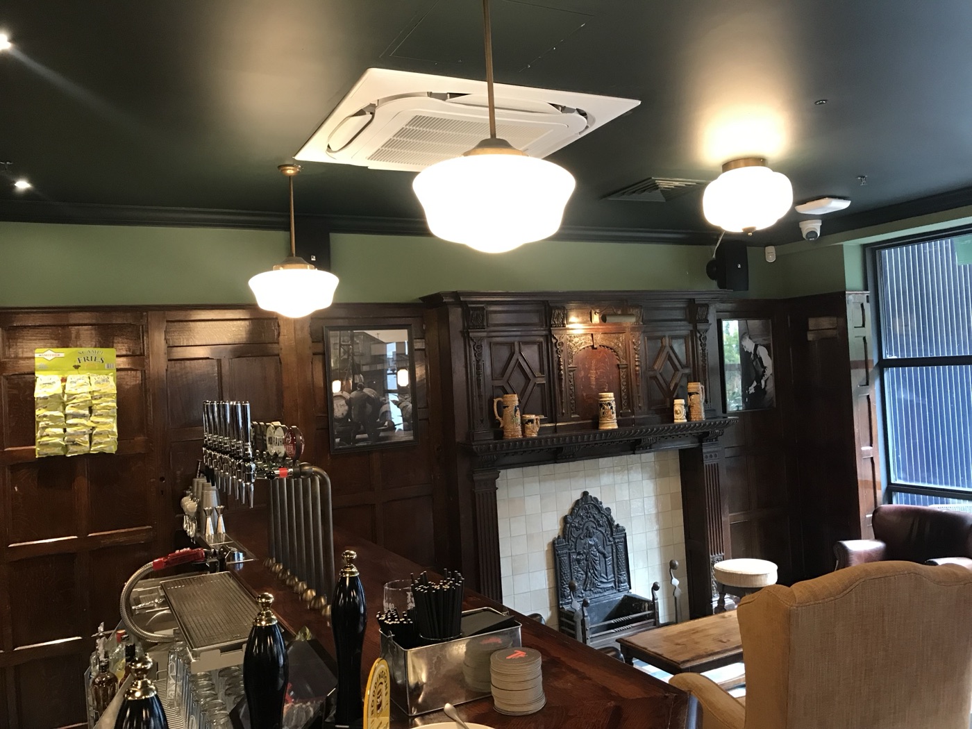 Bar and fireplace with ceiling mounted speaker